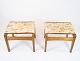 A pair of 
stools in light 
polished wood 
and upholstered 
with light 
fabric from the 
1960s. The ...
