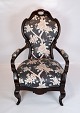 Antique 
armchair of 
polished 
mahogany, 
upholstered 
with floral 
fabric and in 
great vintage 
...