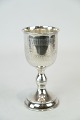 Drinking cup 
with 
decorations of 
hallmarked 
silver from the 
1930s.
15 x 7 cm.