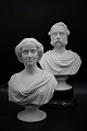 A pair of 1800s 
busts from 
Royal 
Copenhagen in 
biscuit 
by King 
Chr.d.IX & 
Queen Louise. 
H: ...
