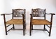 A pair of 
antique 
armchairs of 
dark wood and 
papercord from 
the 1920s. Both 
are in great 
antique ...