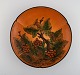 Ipsen's, 
Denmark. 
Circular dish 
with berries 
and foliage in 
hand-painted 
glazed 
ceramics. Model 
...