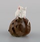 Royal 
Copenhagen 
porcelain 
figurine. Mouse 
on Chestnut. 
Early 20th 
century. Model 
number ...