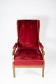 Armchair 
upholstered 
with red velvet 
and mahogany 
designed by 
Fritz 
Henningsen. The 
chair is ...
