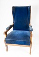 Armchair 
upholstered 
with blue 
velvet and 
mahogany 
designed by 
Fritz 
Henningsen. The 
chair is in ...