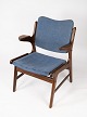 Armchair in 
teak and blue 
fabric, 
designed by 
Arne Hovmand 
Olsen in the 
1960s, is a 
distinctive ...