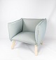 The Dormi 
lounge chair, 
upholstered in 
gray fabric and 
with beech 
legs, is an 
inviting piece 
of ...