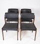 This set of 
four dining 
chairs, with 
black 
upholstery and 
dark wood, is a 
timeless 
example of ...
