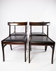 A set of 
"Rungstedlund" 
dining chairs, 
made of 
mahogany and 
upholstered in 
black leather, 
is a ...