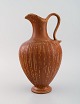 Gunnar Nylund 
for Rörstrand. 
Large vase with 
handle in 
glazed 
stoneware. 
Beautiful glaze 
in ...