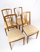 A set of four 
dining room 
chairs of 
mahogany with 
inlaid wood 
upholstered 
with light 
fabric from ...