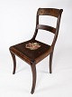 Late empire 
chair of 
mahogany 
upholstered 
with black 
floral fabric 
from the 1840s. 
The chair is 
...