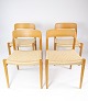 A set of four 
dining chairs, 
model 75, in 
oak and paper 
wicker, 
designed by 
N.O. Møller 
from the ...
