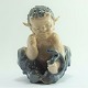 Royal 
Copenhagen; A 
figurine of 
porcelain, a 
faun with a 
snake #1712. 
First. H. 11,5  
cm.
Royal ...