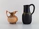 Danish 
ceramist. Two 
unique jugs in 
glazed 
stoneware. 
1960s / 70s.
Largest 
measures: 21.5 
x ...