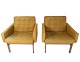 A pair of 
Moduline 
armchairs, 
upholstered in 
dark green 
fabric and 
rosewood, is a 
beautiful ...
