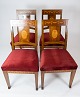 Set of four 
dining room 
chairs of 
walnut with 
inlaid wood and 
upholstered 
with red velvet 
from ...