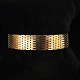 A bracelet of 
14k gold. Clasp 
with two safety 
catches. 
L. 16,8 cm. W. 
13 mm.
Stamped "ECL 
...