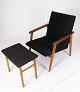 Easy chair with 
stool in teak 
and dark wool 
fabric of 
danish design 
from the 1960s. 
The set is ...