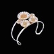 Bernhard Hertz. 
Gilded Sterling 
Silver Daisy 
Bangle.
Five daisies 
with white 
enamel.
Designed ...