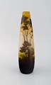 Antique Emile 
Gallé vase in 
yellow frosted 
and dark art 
glass carved in 
the form of a 
park ...