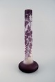 Colossal 
antique Emile 
Gallé vase in 
frosted and 
purple art 
glass carved in 
the form of 
foliage. ...