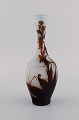 Early Emile 
Gallé vase in 
frosted and 
brown art glass 
carved with 
motifs in the 
form of 
foliage. ...