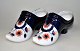 A pair of 
Japanese imari 
shoes in 
porcelain for 
sewing needles, 
19th century. 
Decorated in 
blue, ...