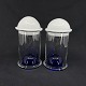Height 18 cm.
A pair of 
mouth-blown 
cylindrical 
containers in 
clear and blue 
glass with 
white ...