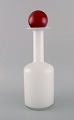 Otto Brauer for 
Holmegaard. 
Vase / bottle 
in white art 
glass with red 
ball. 1960s.
Measures: ...