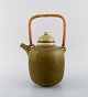Frode 
Blichfeldt 
Bahnsen for 
Palshus. Teapot 
in glazed 
stoneware with 
wicker handle. 
Beautiful ...