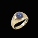 18k Gold Ring 
with Star 
Sapphire.
Size 66 mm - 
US 11½.
Sapphire 0,9 x 
0,8 cm. / 0,35 
x 0,31 ...