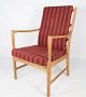 This oak 
armchair with 
cushions 
upholstered in 
red striped 
fabric is a 
wonderful 
example of ...