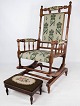 Rocking chair, 
made in Walnut 
and upholstered 
with green 
fabric with a 
matching stool, 
appears ...