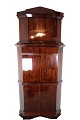 The tall corner 
cabinet/secretary 
in mahogany, in 
beautiful 
antique 
condition from 
the 1840s, is 
...