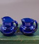 Holmegaard 
Danish 
art-glass, pair 
of creamers of 
dark blue 
glass. 
Both are in a 
fine ...