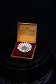 Old Marguerite 
/ Daisy brooch 
in sterling 
silver and 
white enamel 
from A. 
Michaelsen. 
Dia.:3,2cm.