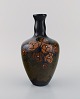 Arnhem, 
Holland. 
Antique art 
nouveau vase in 
glazed ceramics 
with 
hand-painted 
flowers and ...