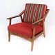Armchair in oak 
and upholstered 
with red 
fabric, 
designed by H. 
Brockmann 
Pedersen in the 
1960s. ...