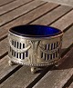 Large, oval 
silver plated 
salt cellar in 
rococo style on 
4 legs, and 
with a deep 
blue glass ...