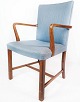 Armchair in 
mahogany and 
upholstered 
with light blue 
fabric by Fritz 
Hansen. The 
chair is in ...