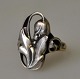 Silver ring, 
1930s, Denmark. 
Decorated with 
foliage. 
Stamped: SGF. 
Size: 56 cm.