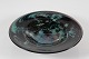 Finn Lynggaard 
(1930-)
Large round 
dish made in 
1977
of aubergine 
and green 
colored ...