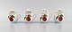 Royal 
Worcester, 
England. Four 
Evesham 
porcelain cream 
cups decorated 
with fruits and 
gold edge. ...
