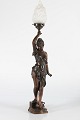 Art Nouveau 
figurine lamp 
circa 1900
Tall table 
lamp made of 
patinated metal 

in the shape 
...