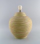European studio 
ceramicist. 
Large table 
lamp in glazed 
stoneware with 
grooved body. 
Beautiful ...