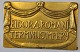 Bronze plaque 
with the text: 
Eidor A. Romani 
Terminus 
Impery. 20th 
century 8.2 x 
12.8 cm. "The 
...