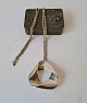 Hans Hansen 
long silver 
necklace with 
large pendant 
in modern 
design
Stamp: Ha.H - 
925s
Length ...