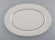 Tapio Wirkkala 
for Rosenthal. 
Rare Modulation 
serving dish in 
fluted 
porcelain. 
Platinum 
Detail. ...