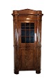 The antique 
Senempire 
corner cabinet 
from Northern 
Germany, made 
of polished 
mahogany and 
dated ...
